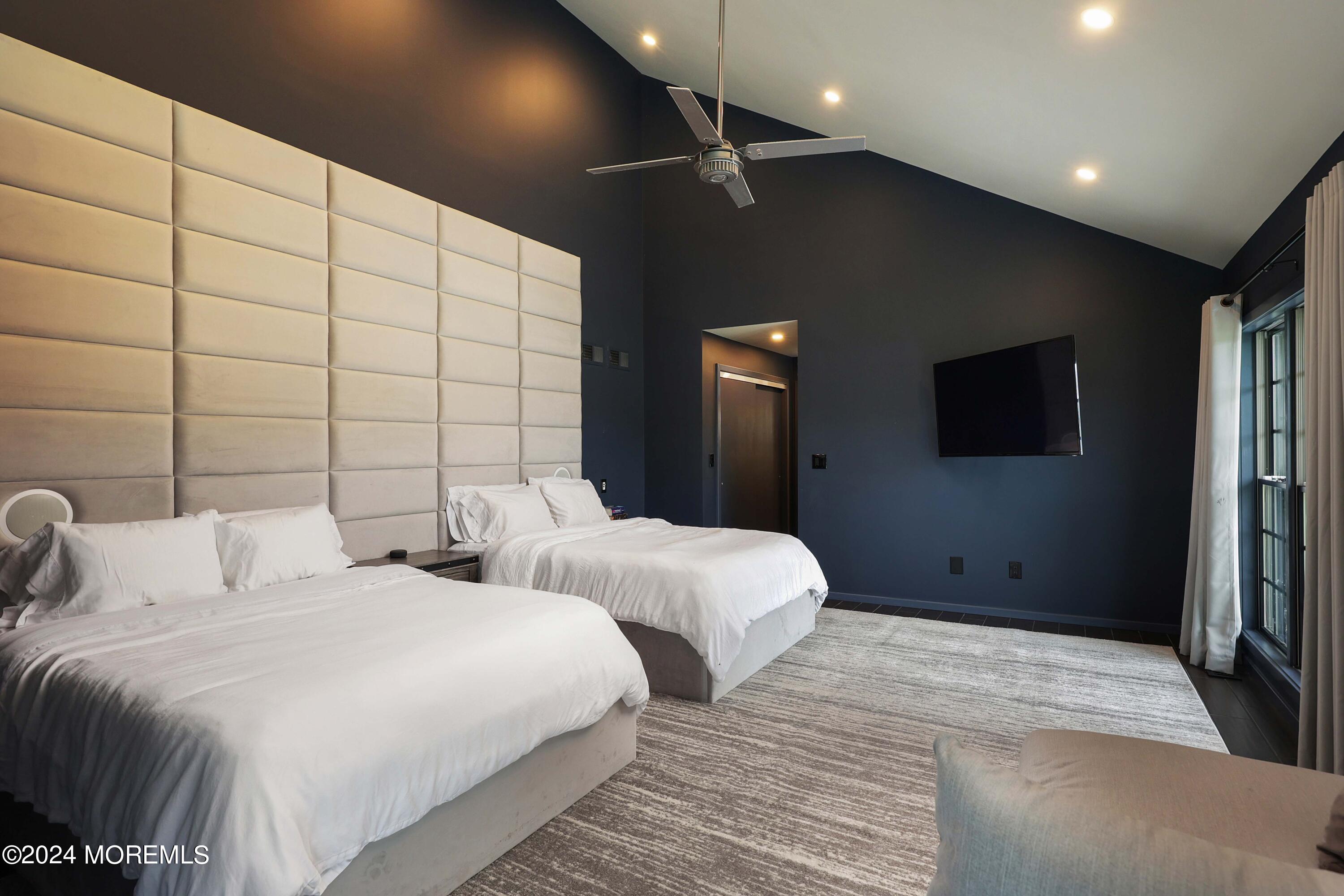 1980 Campbell Road Wall, NJ 07719 - Photo 48 of 110 a bedroom with two bed and a flat screen tv