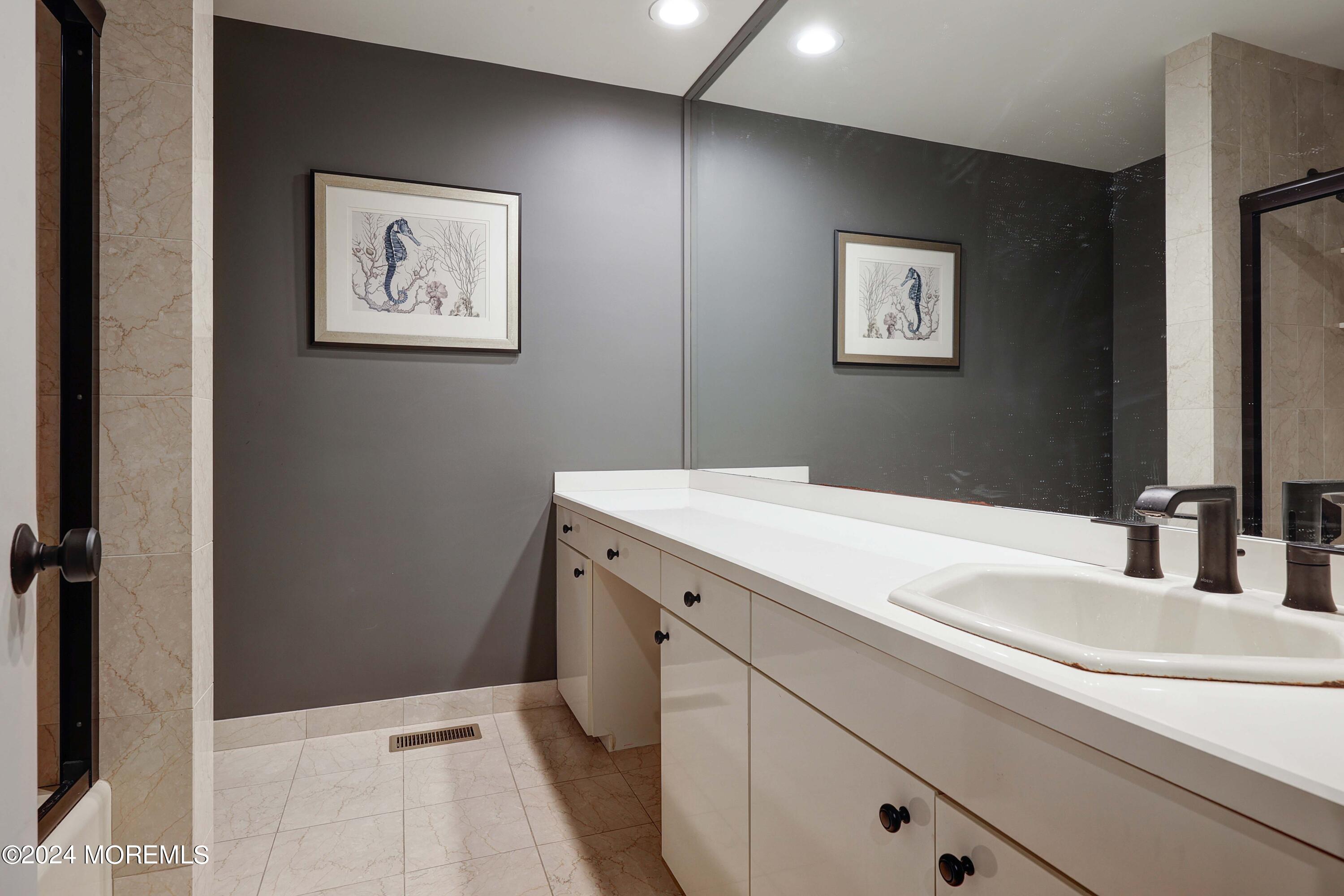 1980 Campbell Road Wall, NJ 07719 - Photo 52 of 110 a bathroom with a sink and a mirror