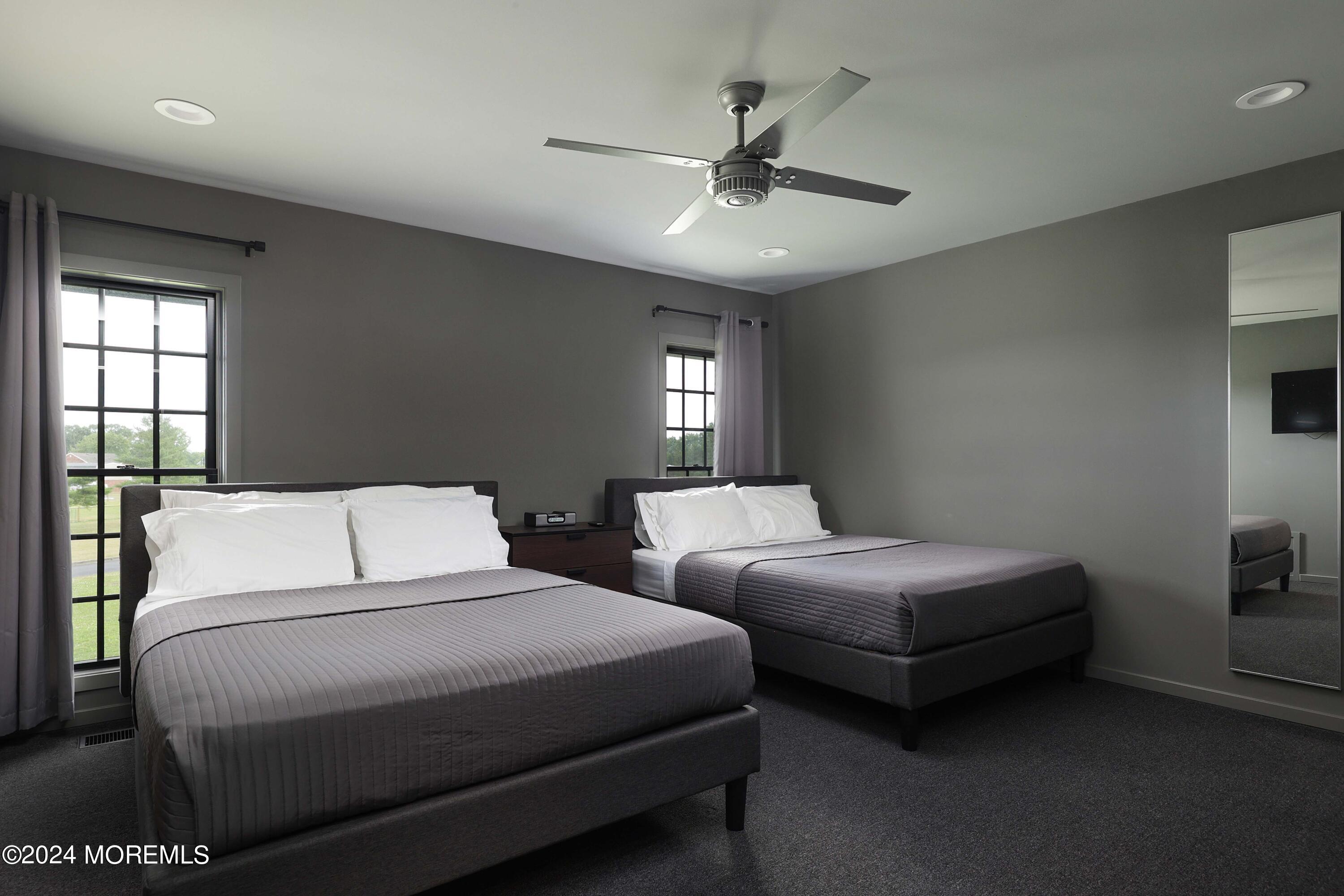 1980 Campbell Road Wall, NJ 07719 - Photo 62 of 110 a bedroom with two beds and ceiling fan