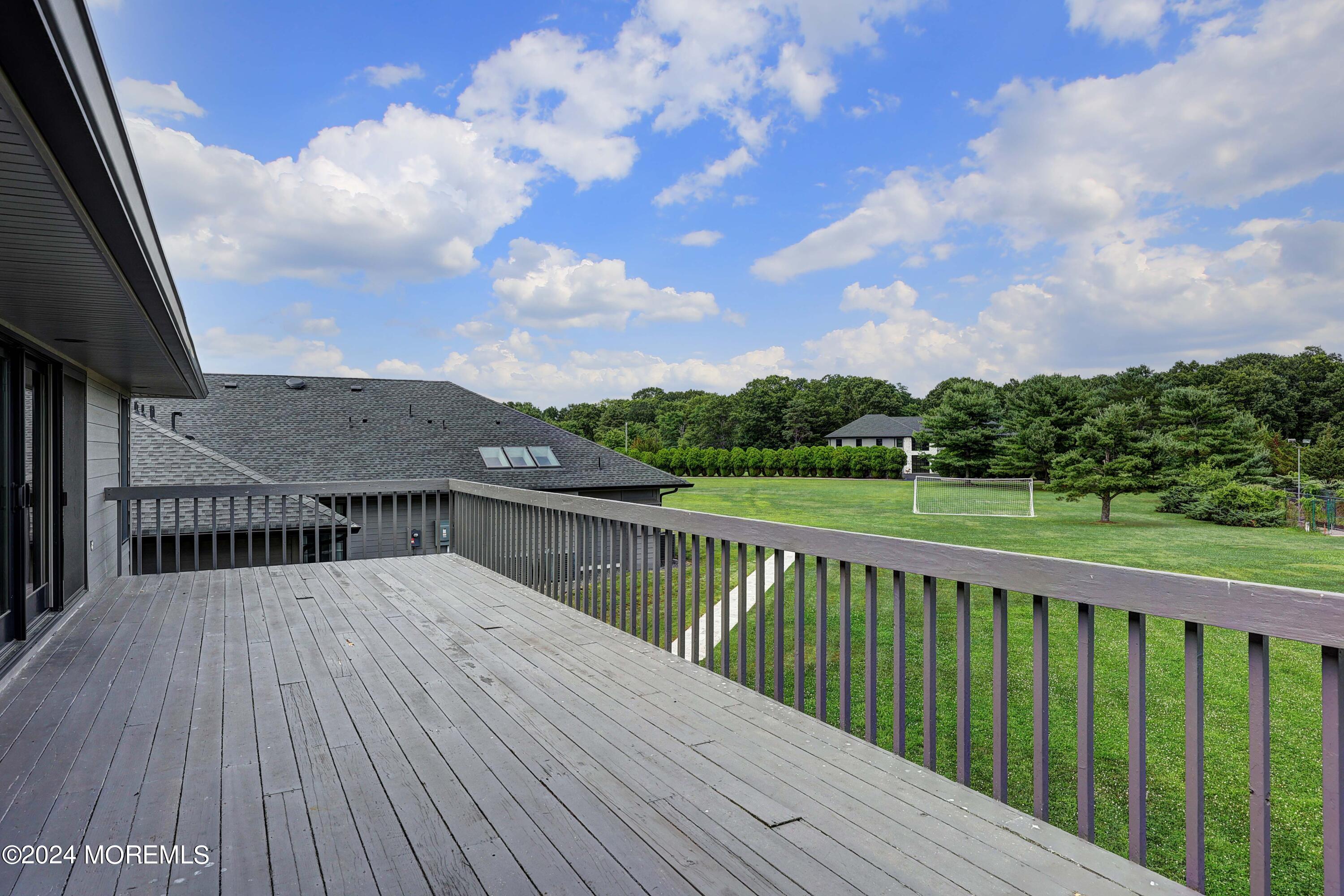 1980 Campbell Road Wall, NJ 07719 - Photo 65 of 110 a view of balcony with wooden floor and fence