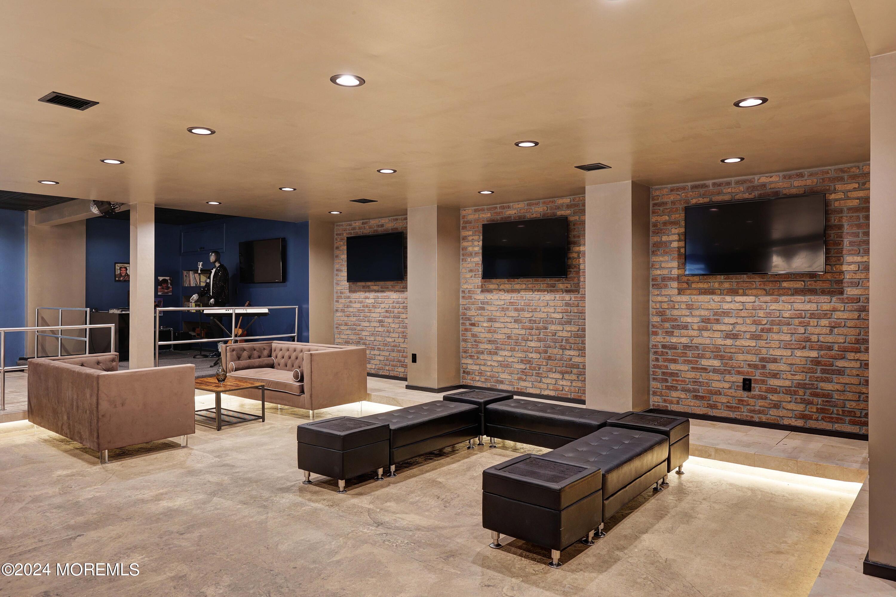 1980 Campbell Road Wall, NJ 07719 - Photo 68 of 110 a living room with fireplace furniture and a flat screen tv