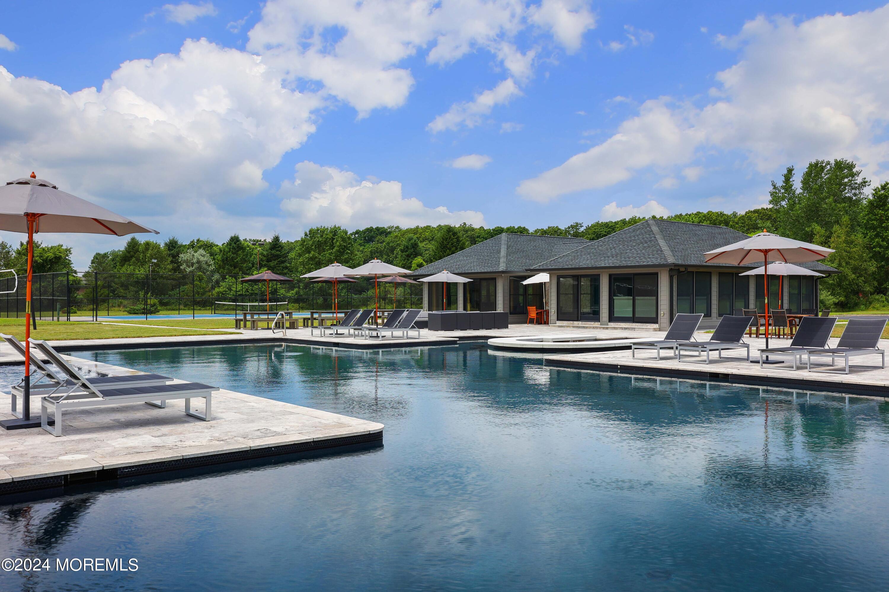 1980 Campbell Road Wall, NJ 07719 - Photo 80 of 110 a view of a swimming pool and lounge chair