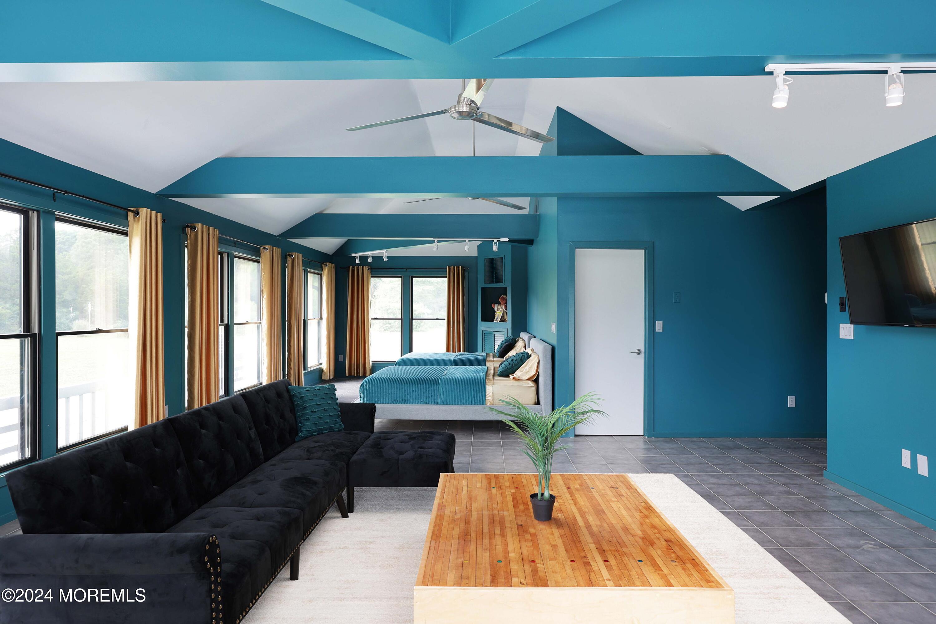 1980 Campbell Road Wall, NJ 07719 - Photo 81 of 110 a living room with furniture and a flat screen tv