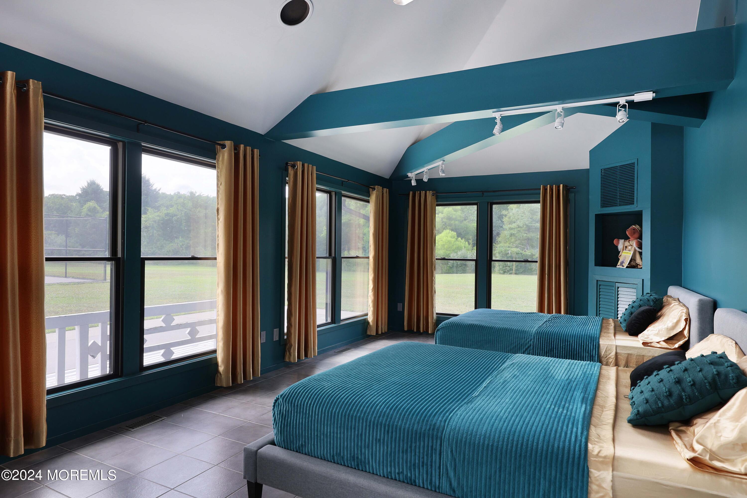 1980 Campbell Road Wall, NJ 07719 - Photo 82 of 110 a large bedroom with a large bed and large windows