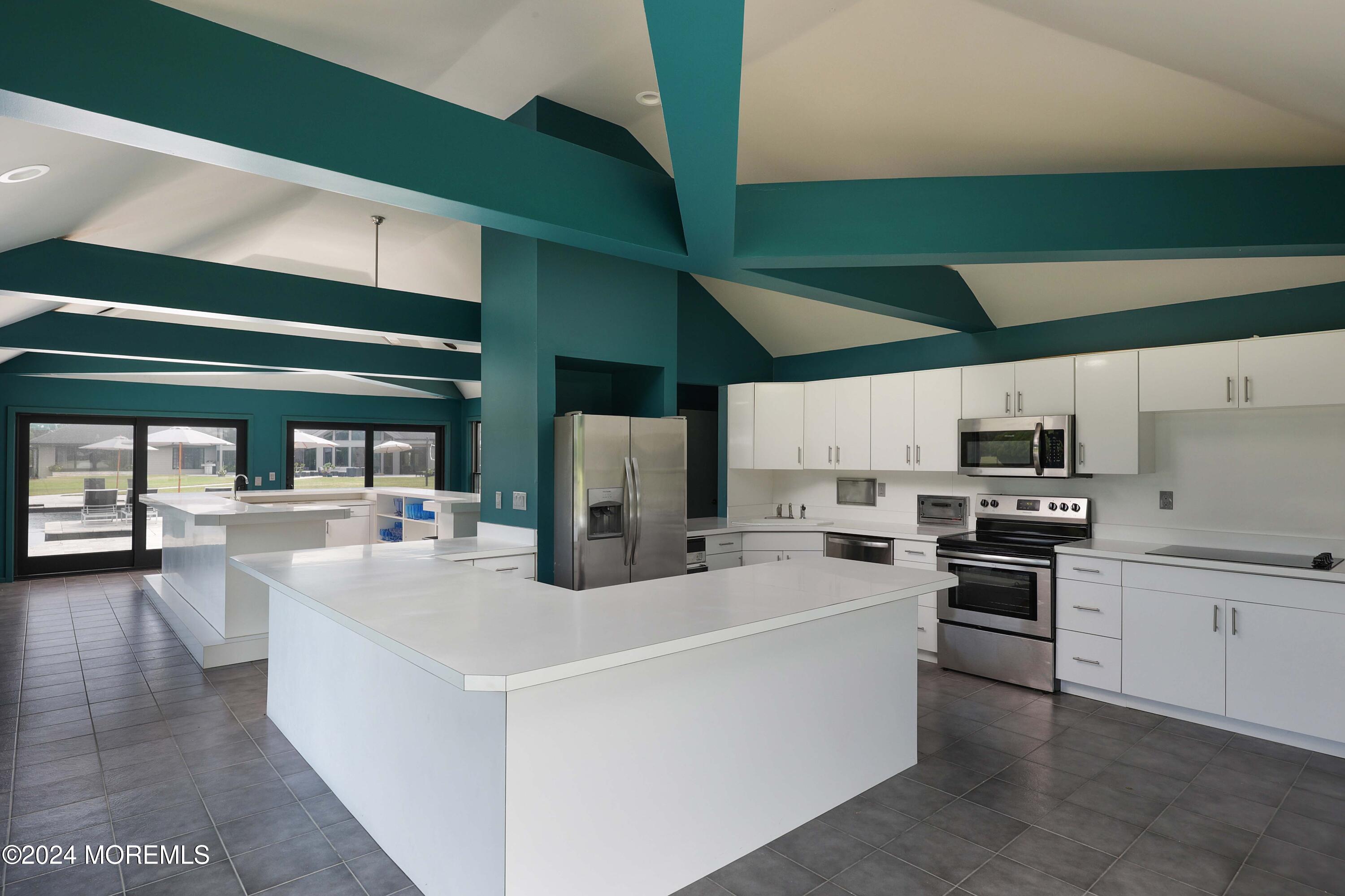 1980 Campbell Road Wall, NJ 07719 - Photo 87 of 110 a kitchen with stainless steel appliances and white cabinets