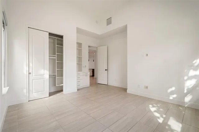 a bathroom with a granite countertop sink a toilet and bathtub