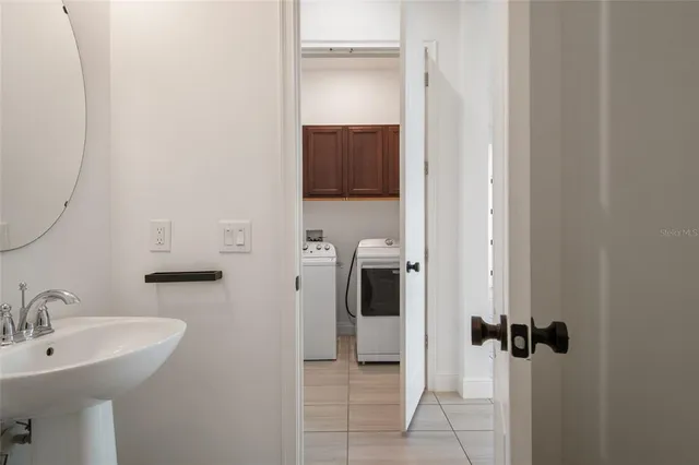 a utility room with dryer and washer
