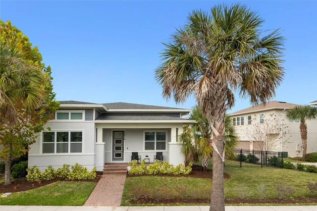 a front view of house with yard and green space