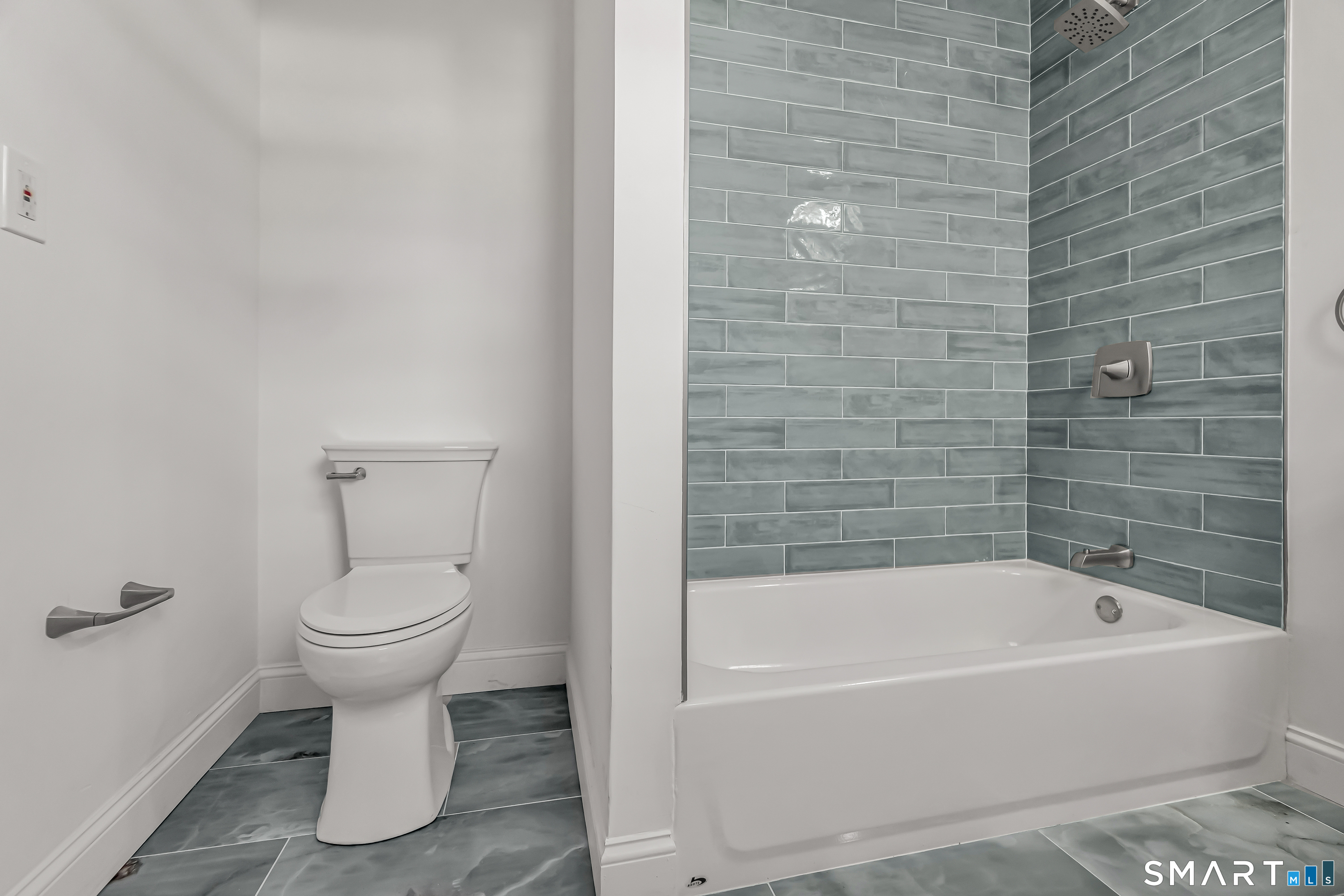 1770 Stratfield Road Fairfield, CT 06825 - Photo 20 of 40 a bathroom with a toilet and sink