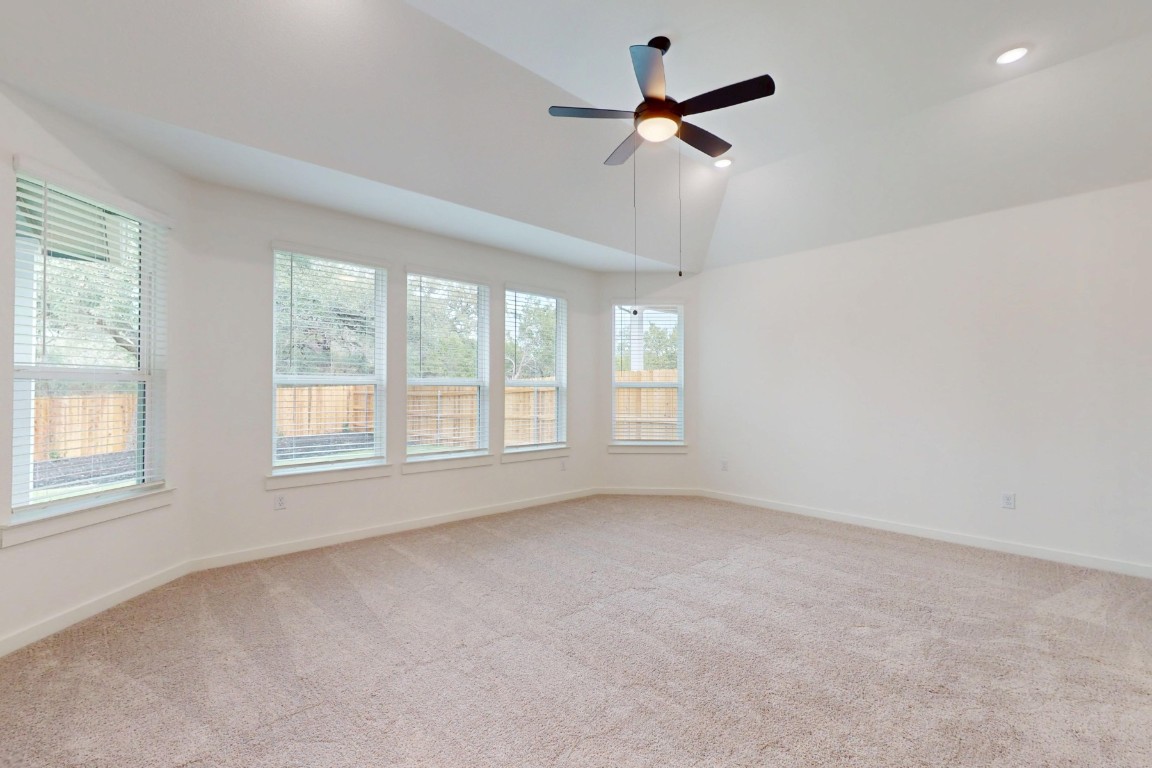3913 Waxahachie Road Leander, TX 78641 - Photo 20 of 39 an empty room with a window and a fan