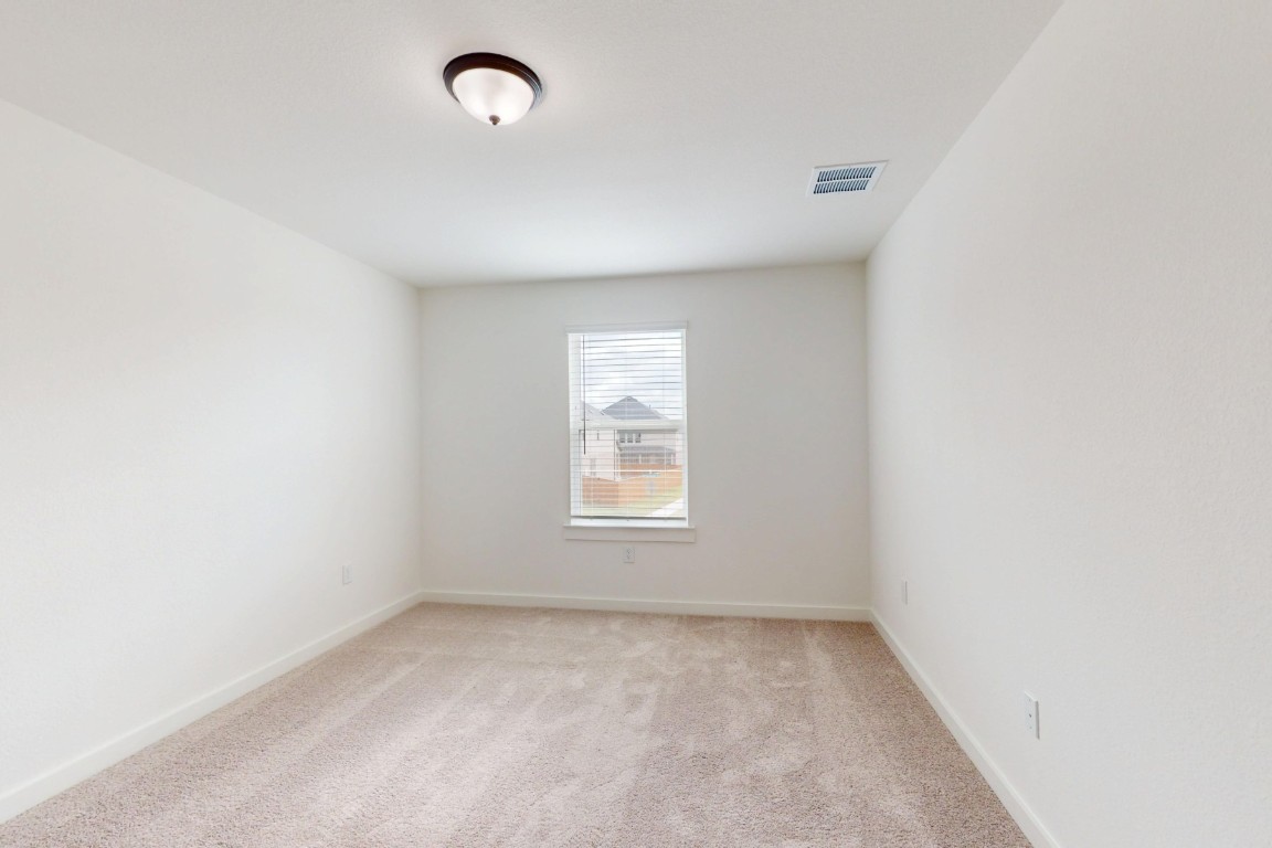 3913 Waxahachie Road Leander, TX 78641 - Photo 26 of 39 an empty room with windows