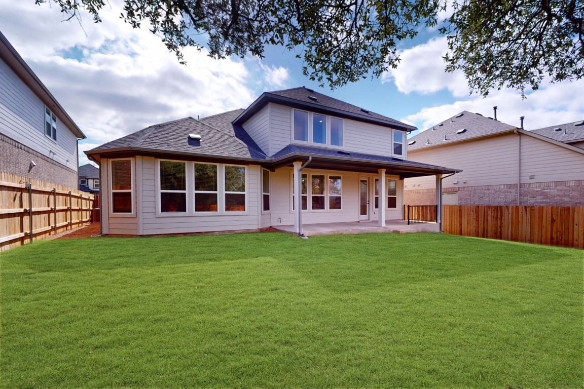 3913 Waxahachie Road Leander, TX 78641 - Photo 34 of 39 a view of a yard in front of a house with large trees