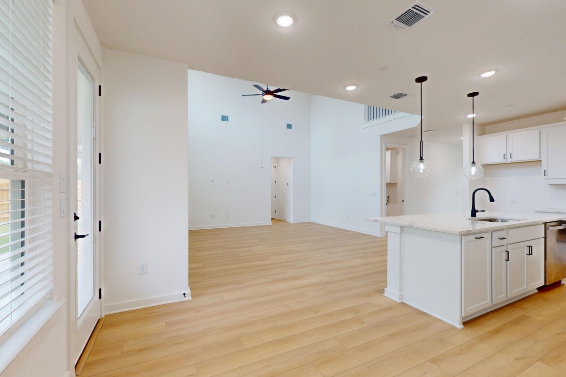 3913 Waxahachie Road Leander, TX 78641 - Photo 9 of 39 a spacious bathroom with a granite countertop sink a mirror and shower