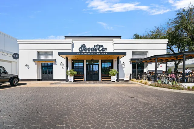 a view of a building with sitting area