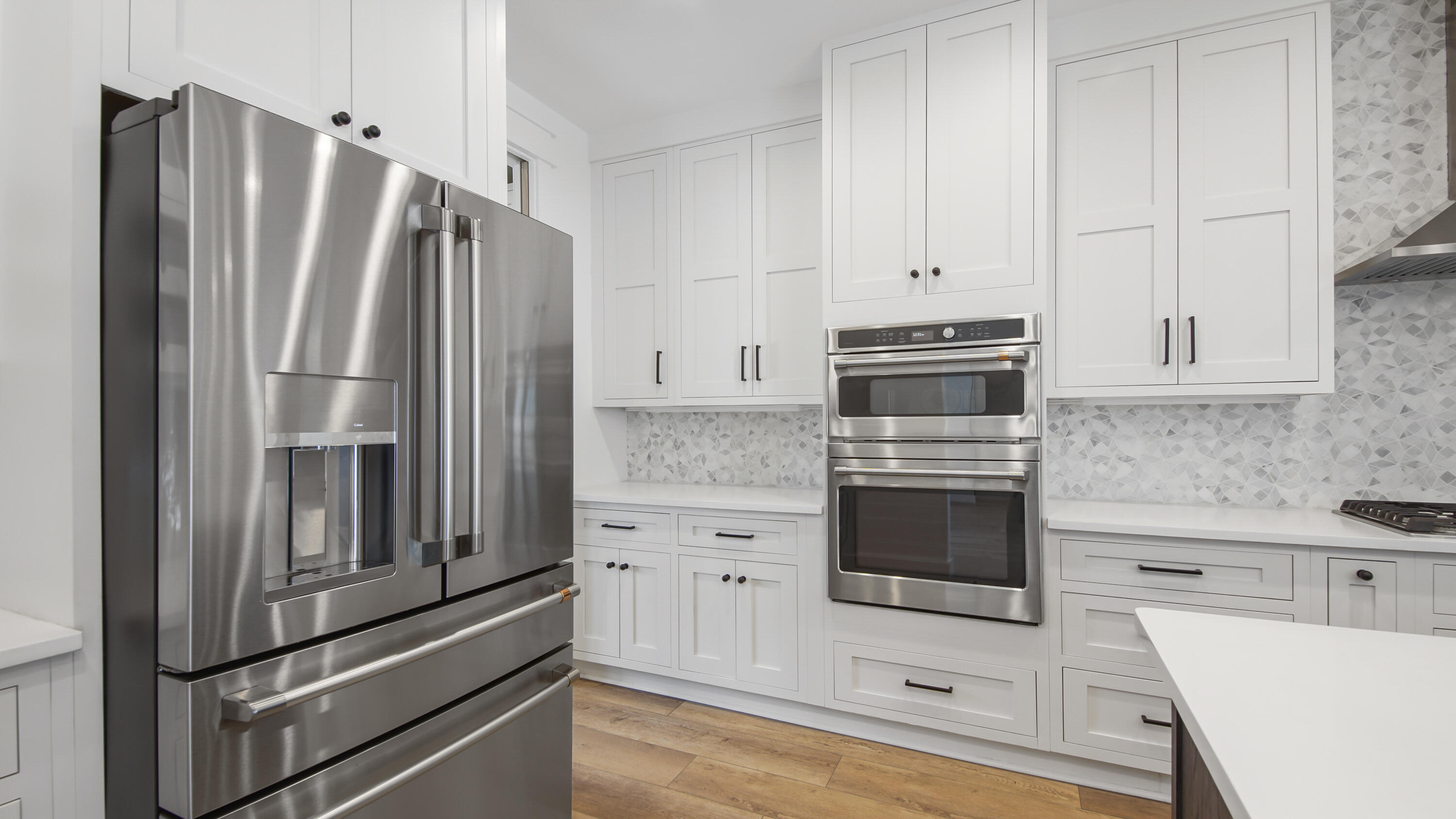 515 Hideaway Circle Santa Rosa Beach, FL 32459 - Photo 17 of 64 a kitchen with granite countertop white cabinets and stainless steel appliances