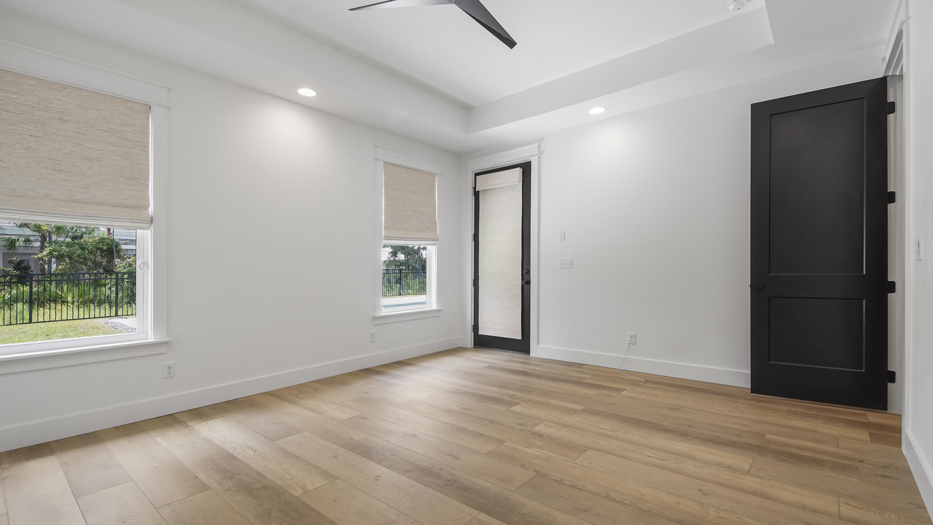 515 Hideaway Circle Santa Rosa Beach, FL 32459 - Photo 20 of 64 an empty room with wooden floor and windows