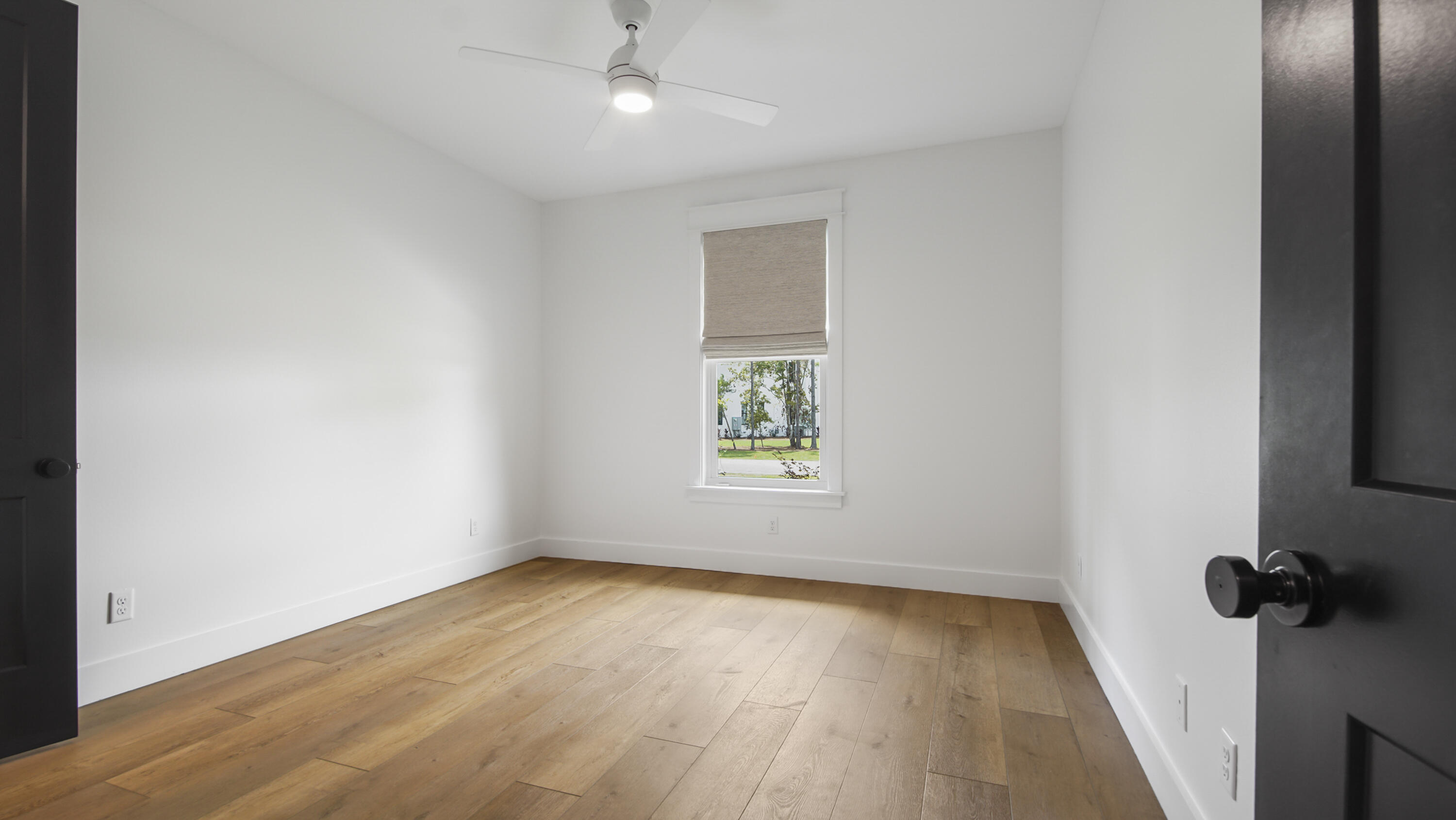 515 Hideaway Circle Santa Rosa Beach, FL 32459 - Photo 32 of 64 an empty room with a window and a ceiling fan