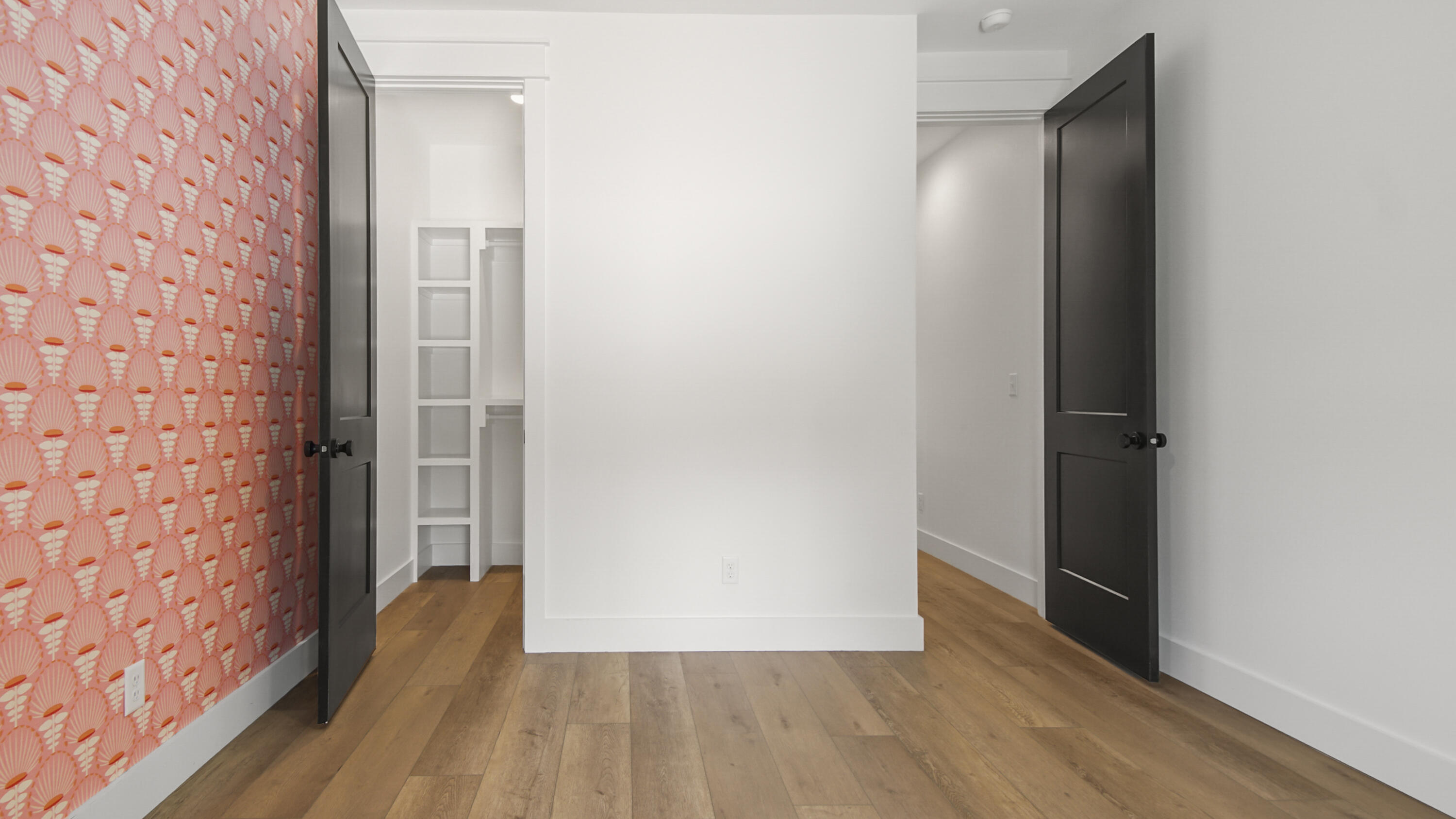515 Hideaway Circle Santa Rosa Beach, FL 32459 - Photo 37 of 64 a view of a hallway with wooden floor and a bathroom