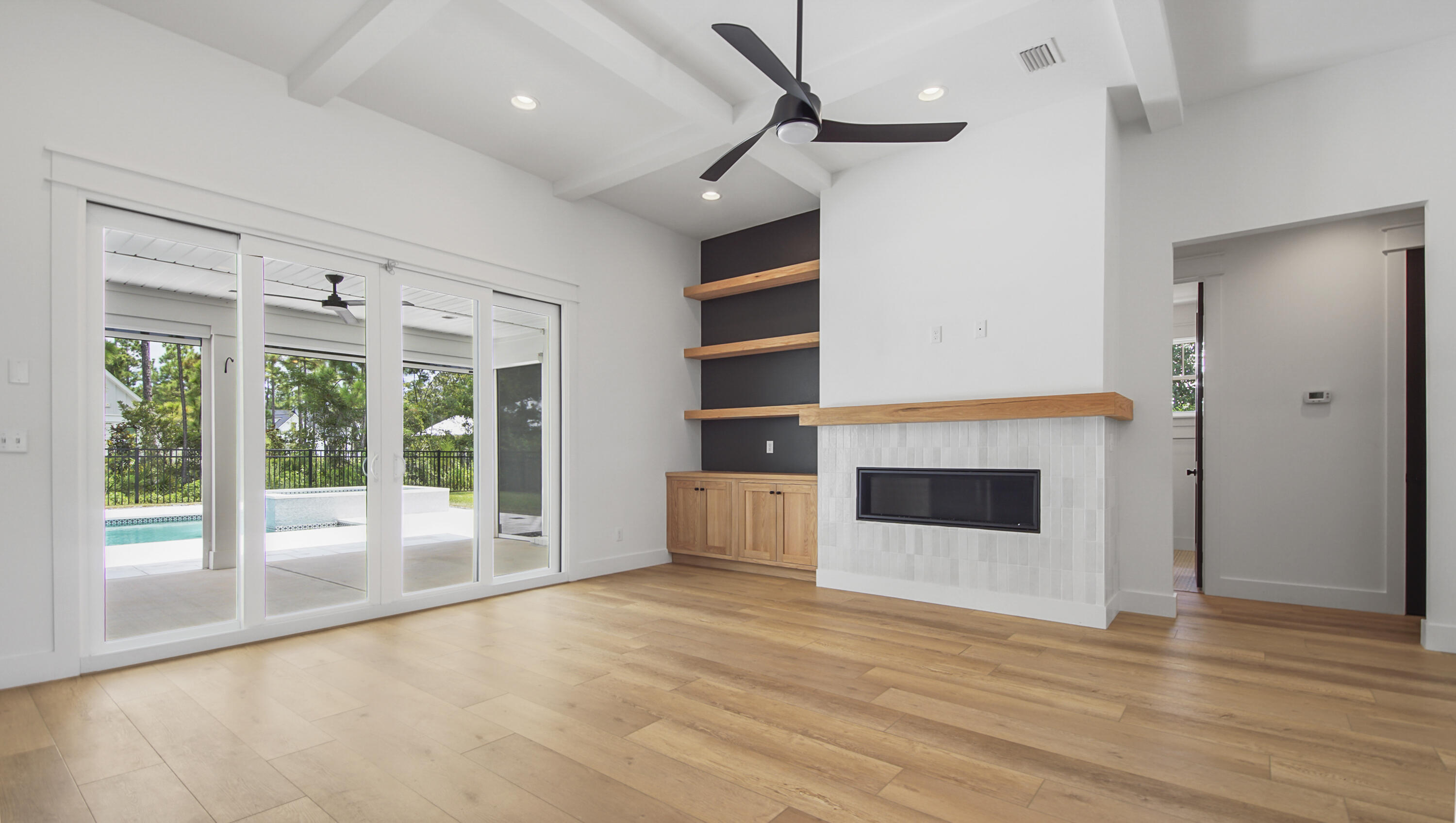 515 Hideaway Circle Santa Rosa Beach, FL 32459 - Photo 5 of 64 a view of an empty room with a fireplace and a window