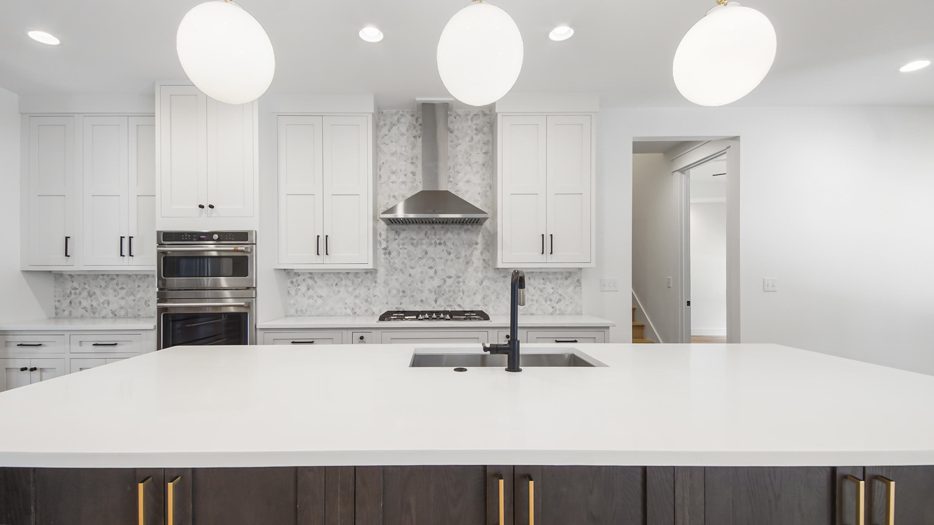 515 Hideaway Circle Santa Rosa Beach, FL 32459 - Photo 7 of 64 a kitchen with stainless steel appliances a stove a sink and white cabinets