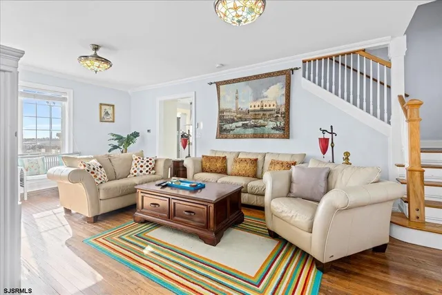 a living room with furniture fireplace and a window