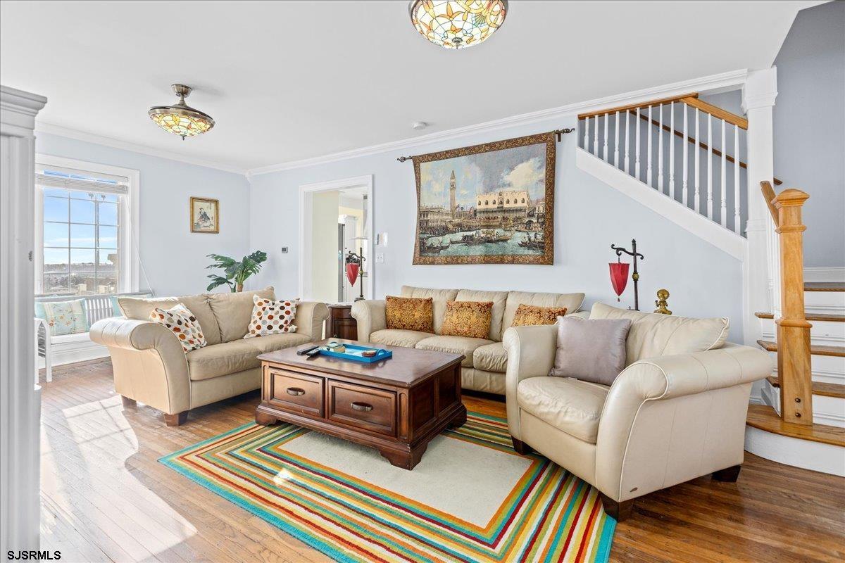 104 South Oakland Avenue, Unit JULY '26 Ventnor City, NJ 08406 - Photo 16 of 57 a living room with furniture and a wooden floor