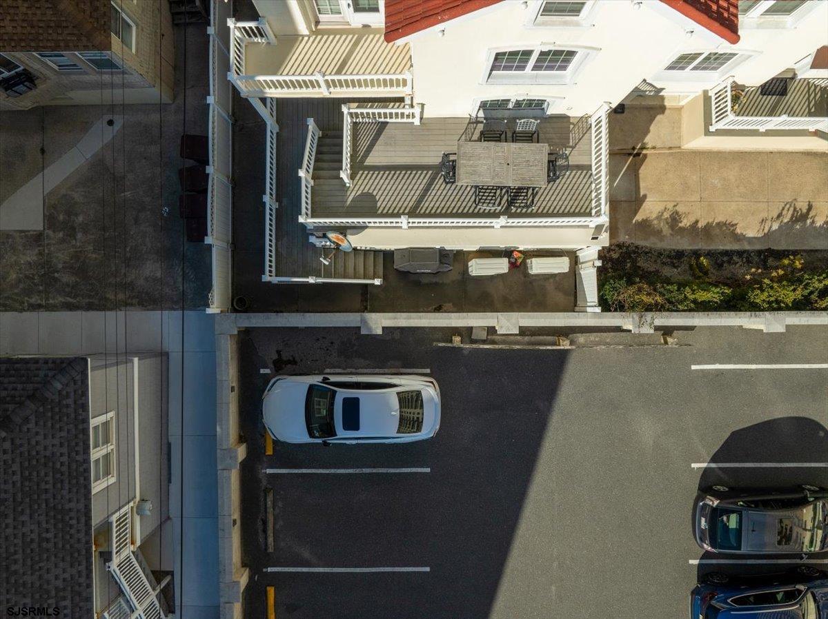 104 South Oakland Avenue, Unit JULY '26 Ventnor City, NJ 08406 - Photo 55 of 57 a front view of a building with parking space