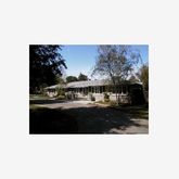 a picture of a living room with a sink and cabinets