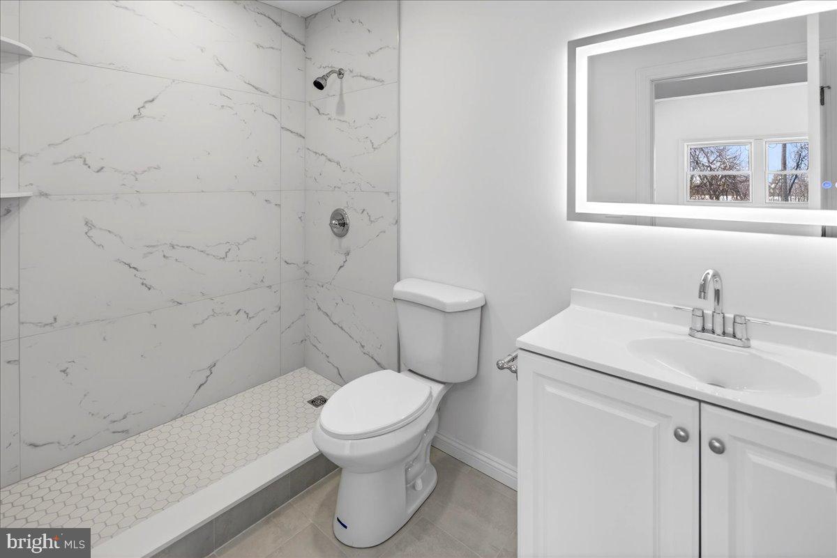 464 Sykesville Road Wrightstown, NJ 08562 - Photo 19 of 32 a white toilet sitting next to a bathroom sink
