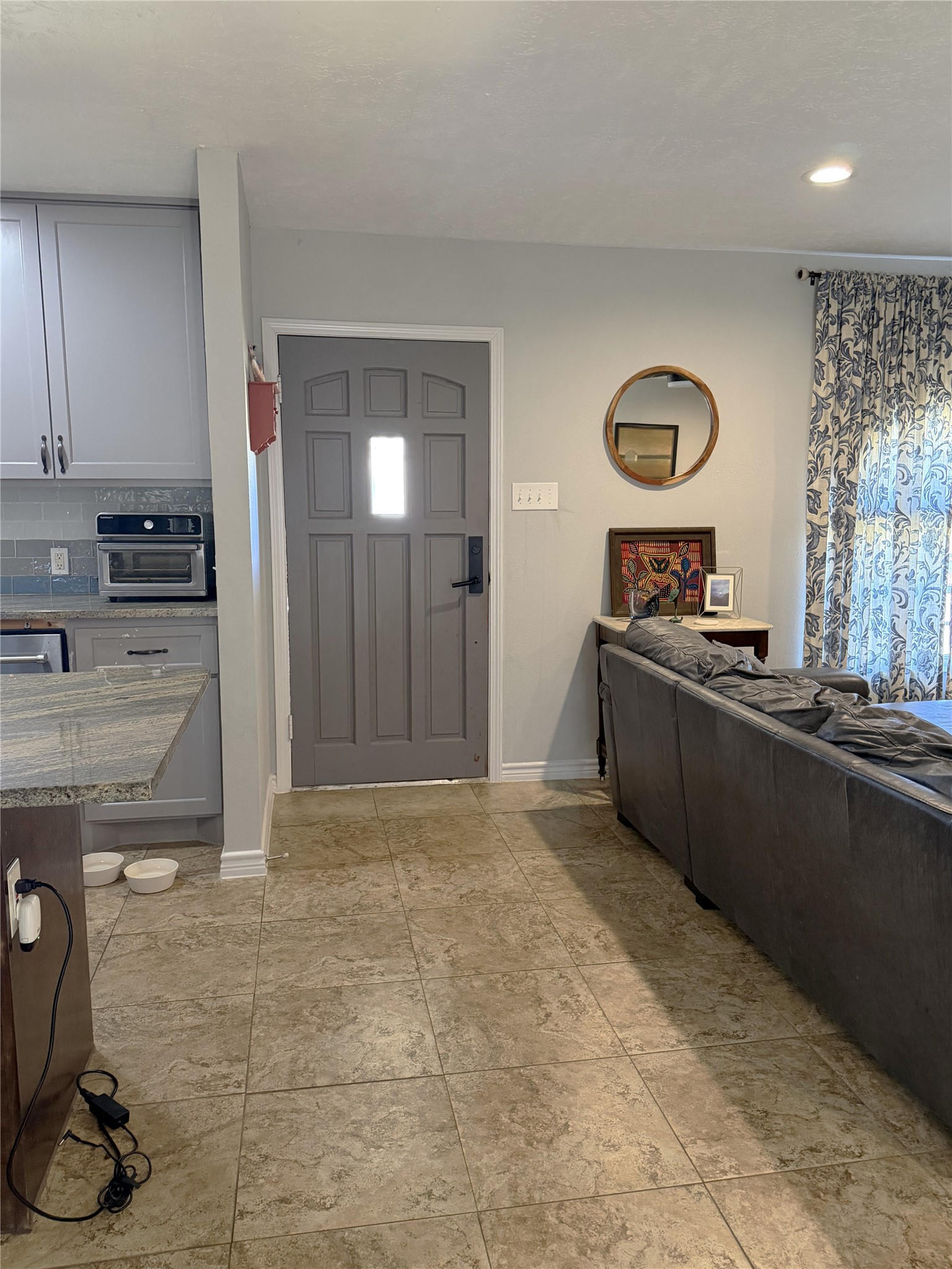 1002 Washington Street Brenham, TX 77833 - Photo 2 of 25 a kitchen with stainless steel appliances granite countertop a stove a sink and a refrigerator