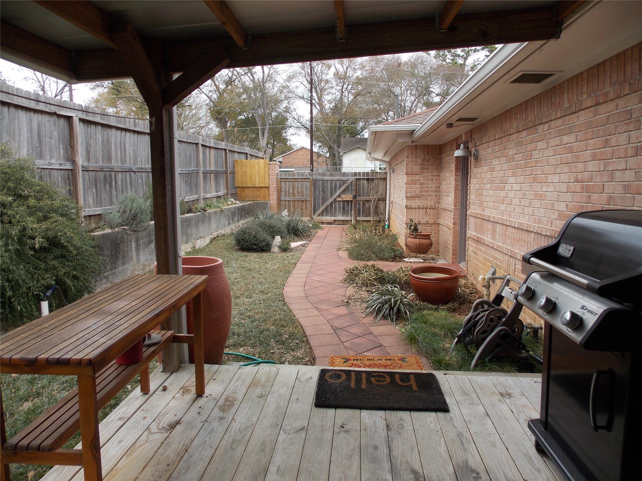1002 Washington Street Brenham, TX 77833 - Photo 22 of 25 a view of a deck with wooden floor and outdoor seating