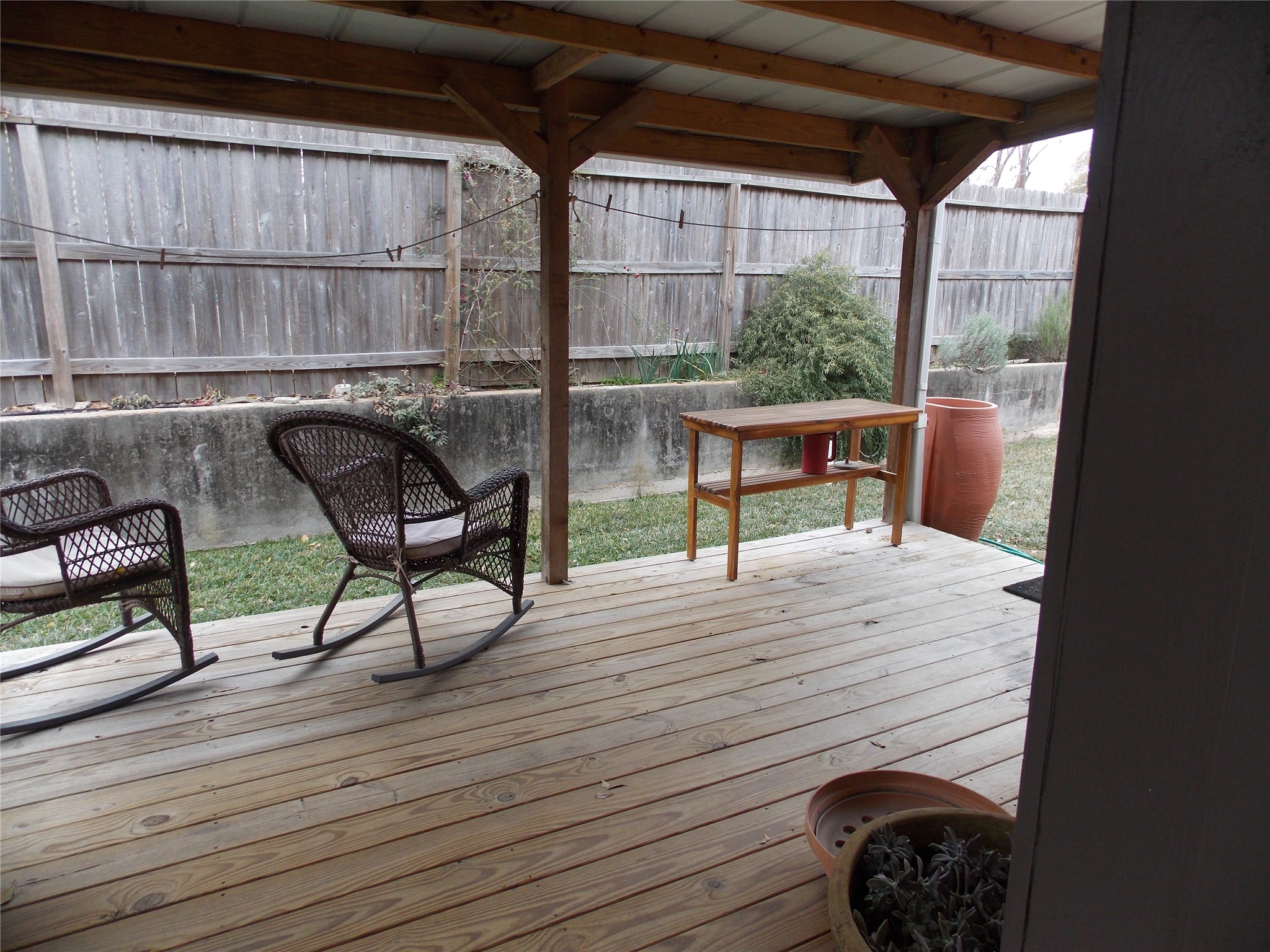 1002 Washington Street Brenham, TX 77833 - Photo 23 of 25 a view of a deck with wooden floor and outdoor seating