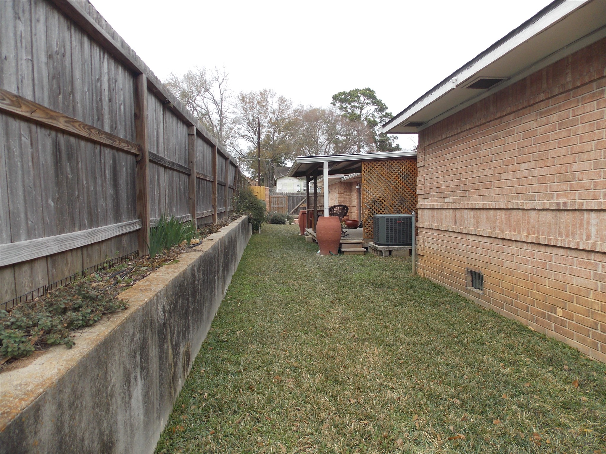 1002 Washington Street Brenham, TX 77833 - Photo 24 of 25 a view of a house with backyard and sitting area