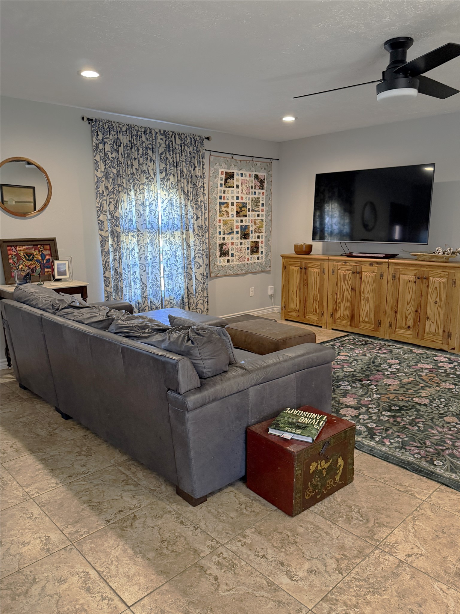1002 Washington Street Brenham, TX 77833 - Photo 3 of 25 a living room with furniture and a flat screen tv
