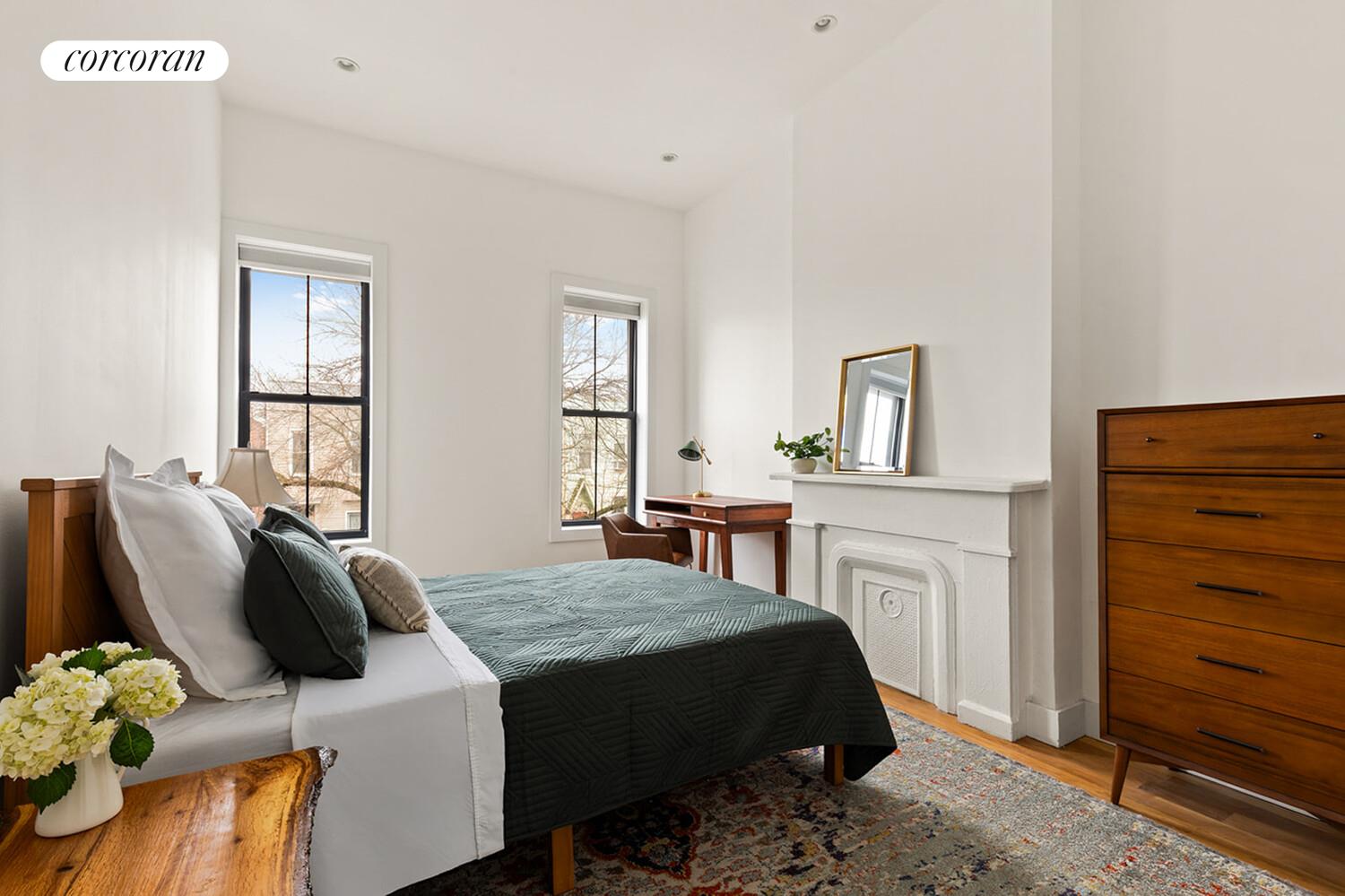 1079 Hancock Street Brooklyn, NY 11221 - Photo 11 of 22 a bedroom with a bed and dresser