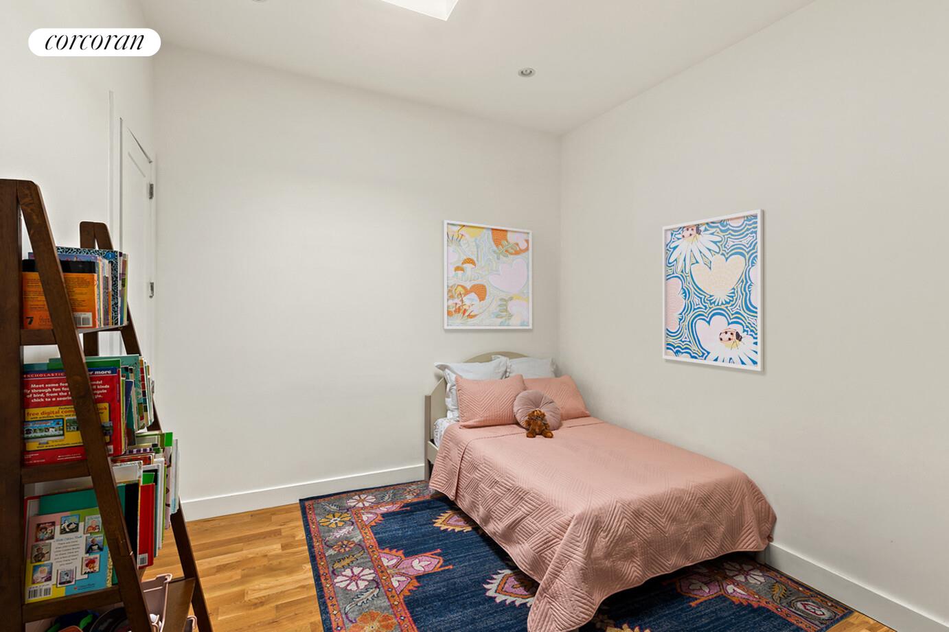 1079 Hancock Street Brooklyn, NY 11221 - Photo 12 of 22 a bedroom with a bed and wooden floor