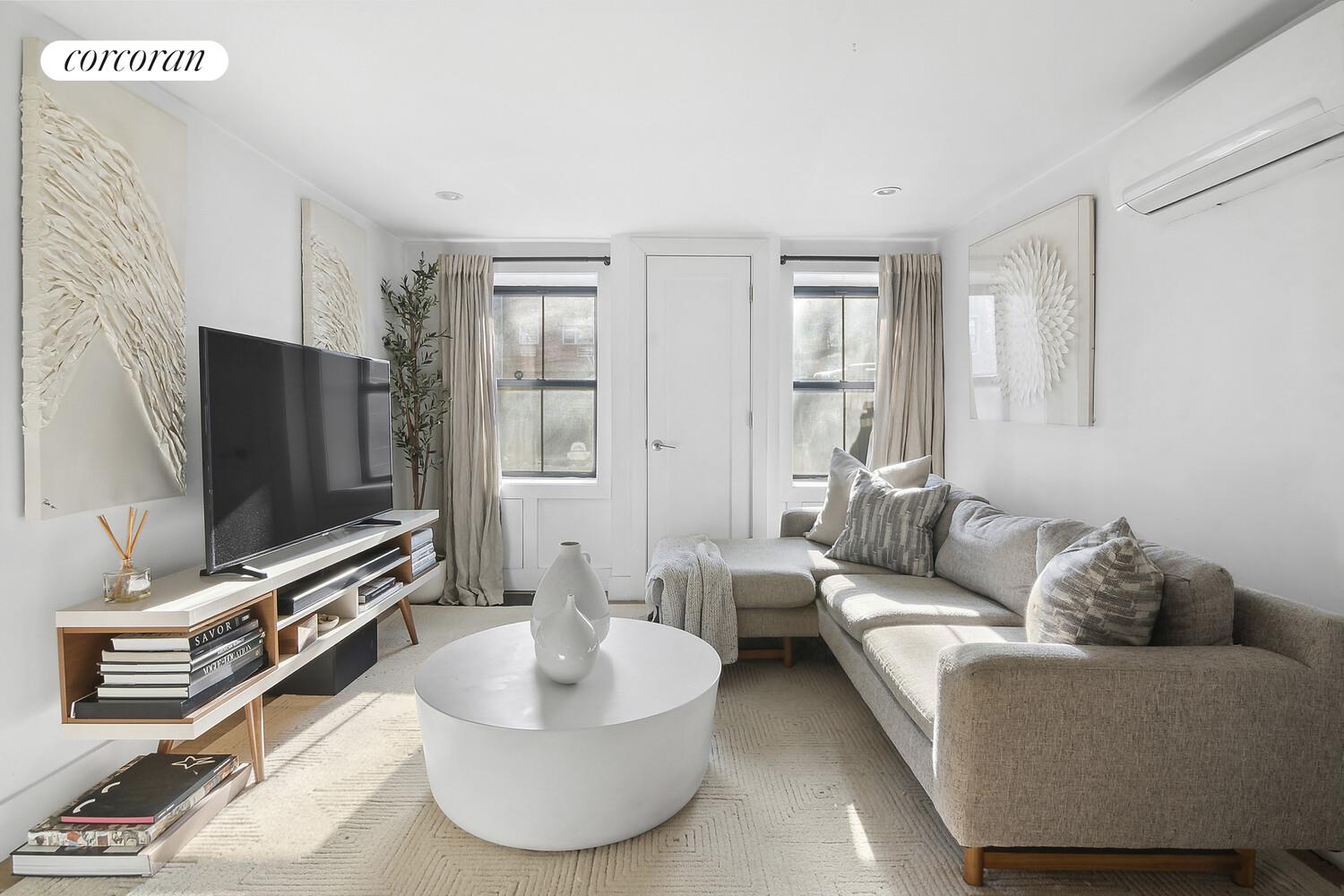 1079 Hancock Street Brooklyn, NY 11221 - Photo 15 of 22 a living room with furniture and a flat screen tv