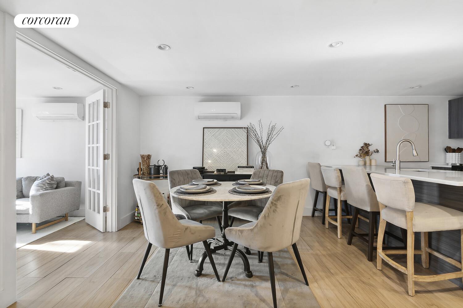 1079 Hancock Street Brooklyn, NY 11221 - Photo 17 of 22 a view of a dining room with furniture and wooden floor