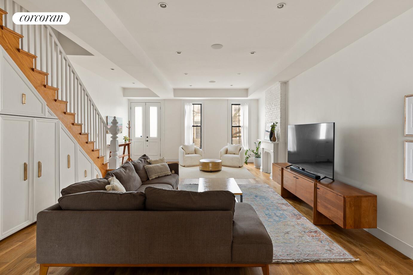 1079 Hancock Street Brooklyn, NY 11221 - Photo 2 of 22 a living room with furniture and a flat screen tv