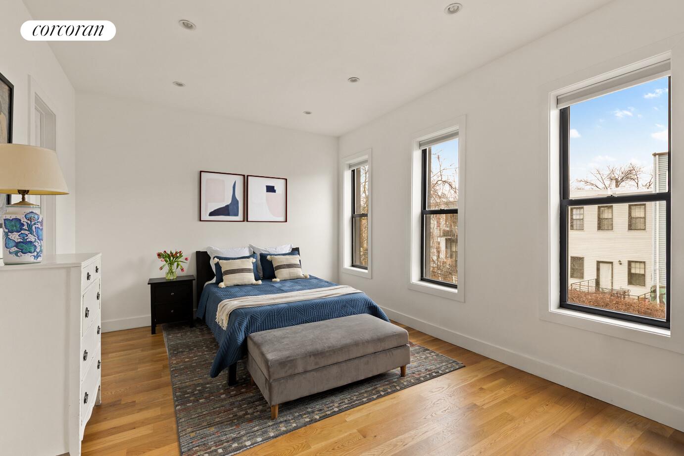 1079 Hancock Street Brooklyn, NY 11221 - Photo 9 of 22 a bedroom with a bed and wooden floor