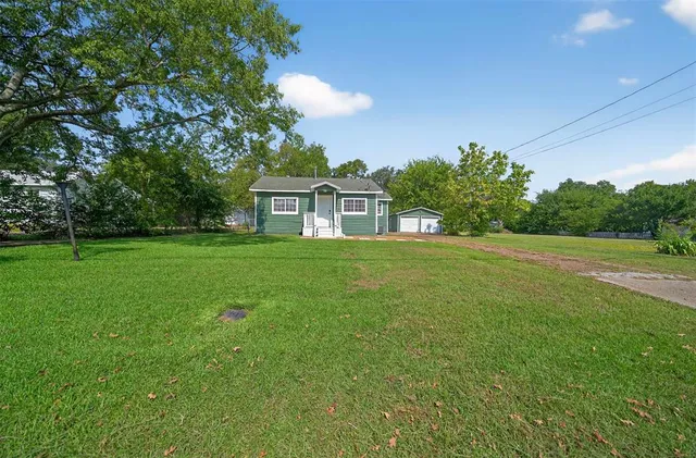 a house view with a garden space