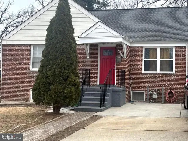 a view of a house with a yard and windows