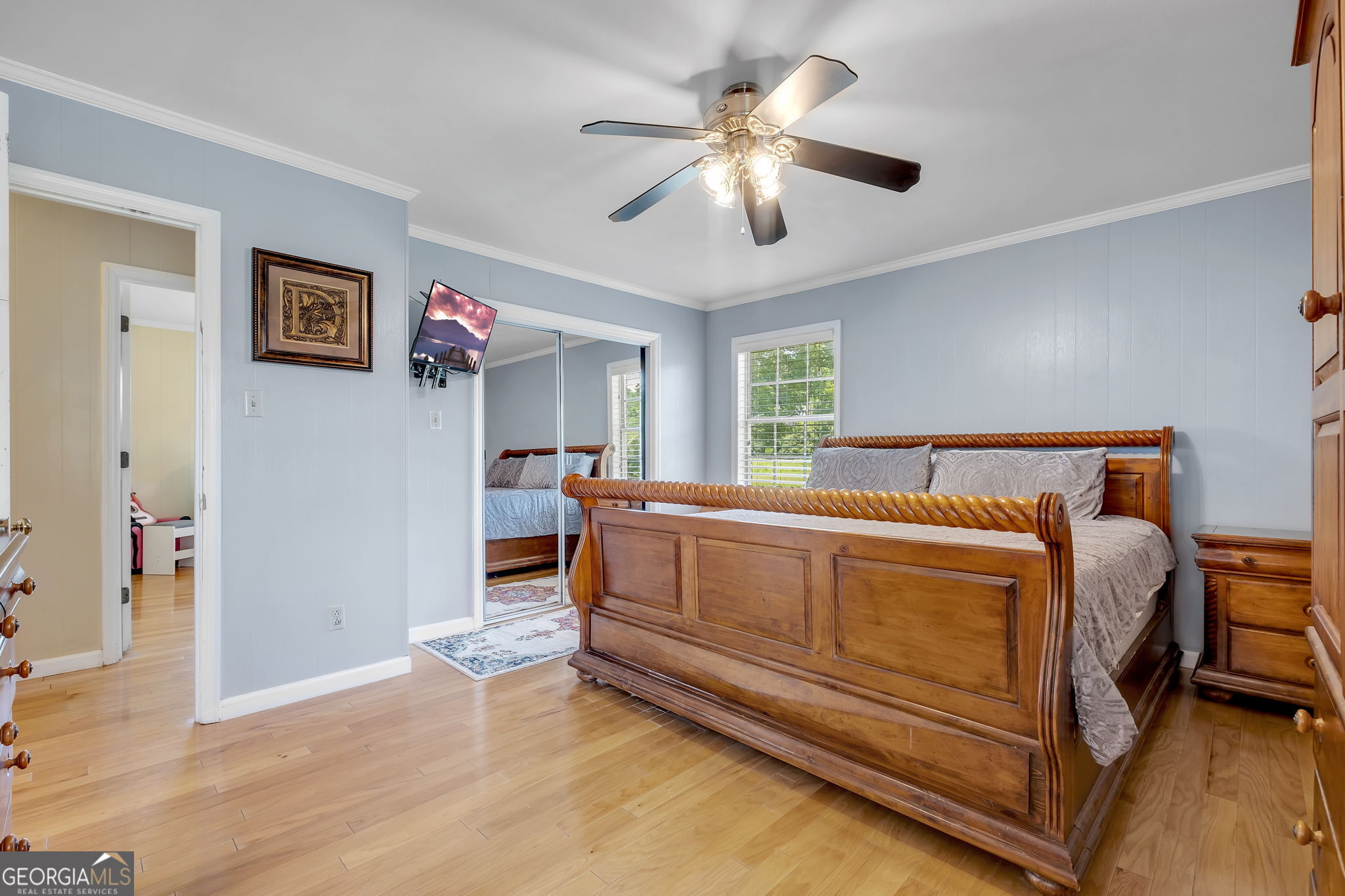 171 Council Lane Cairo, GA 39828 - Photo 12 of 44 a spacious bedroom with a bed and a chandelier