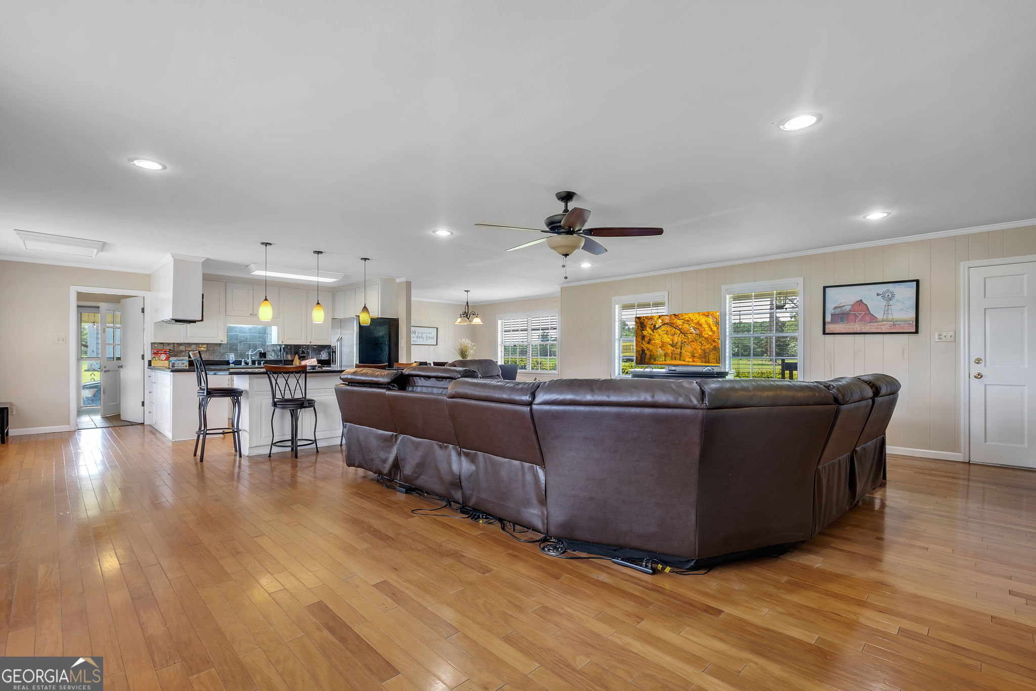 171 Council Lane Cairo, GA 39828 - Photo 18 of 44 a living room with couches and kitchen view with wooden floor