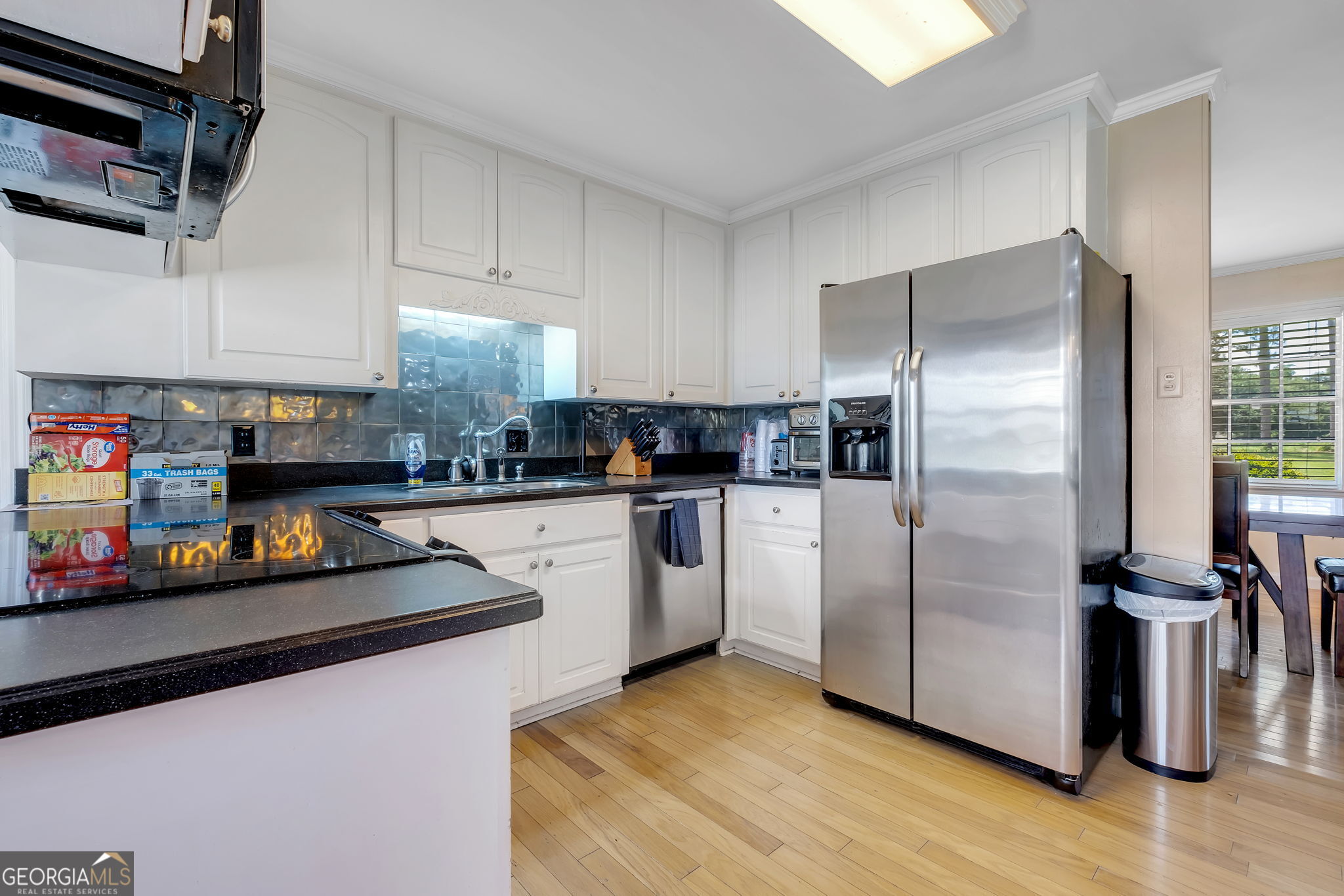 171 Council Lane Cairo, GA 39828 - Photo 25 of 44 a kitchen with stainless steel appliances granite countertop a refrigerator sink and stove