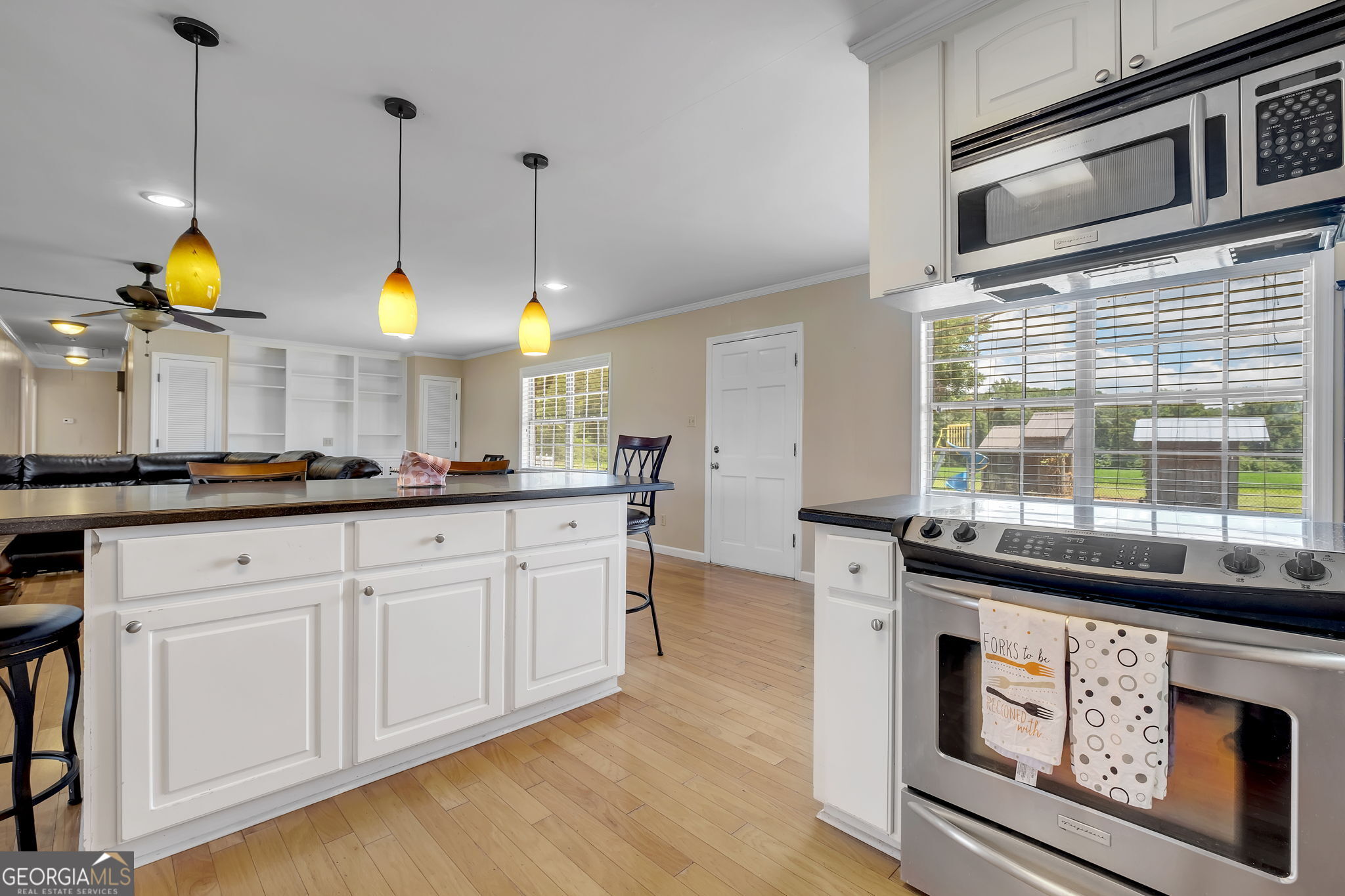 171 Council Lane Cairo, GA 39828 - Photo 27 of 44 a kitchen with stainless steel appliances granite countertop a stove a sink and a microwave