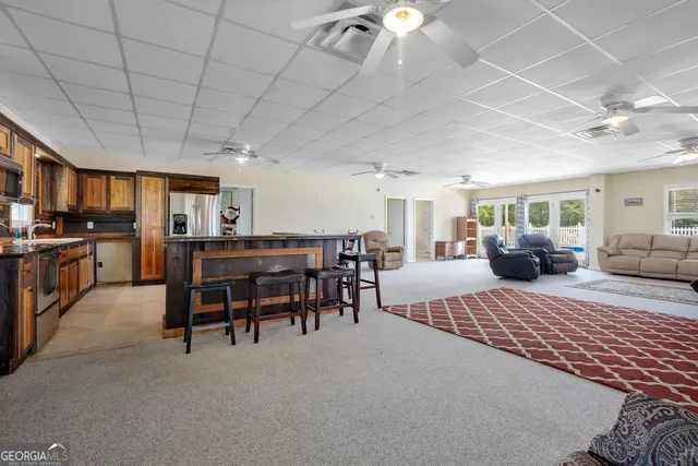 a bedroom with furniture and a chandelier