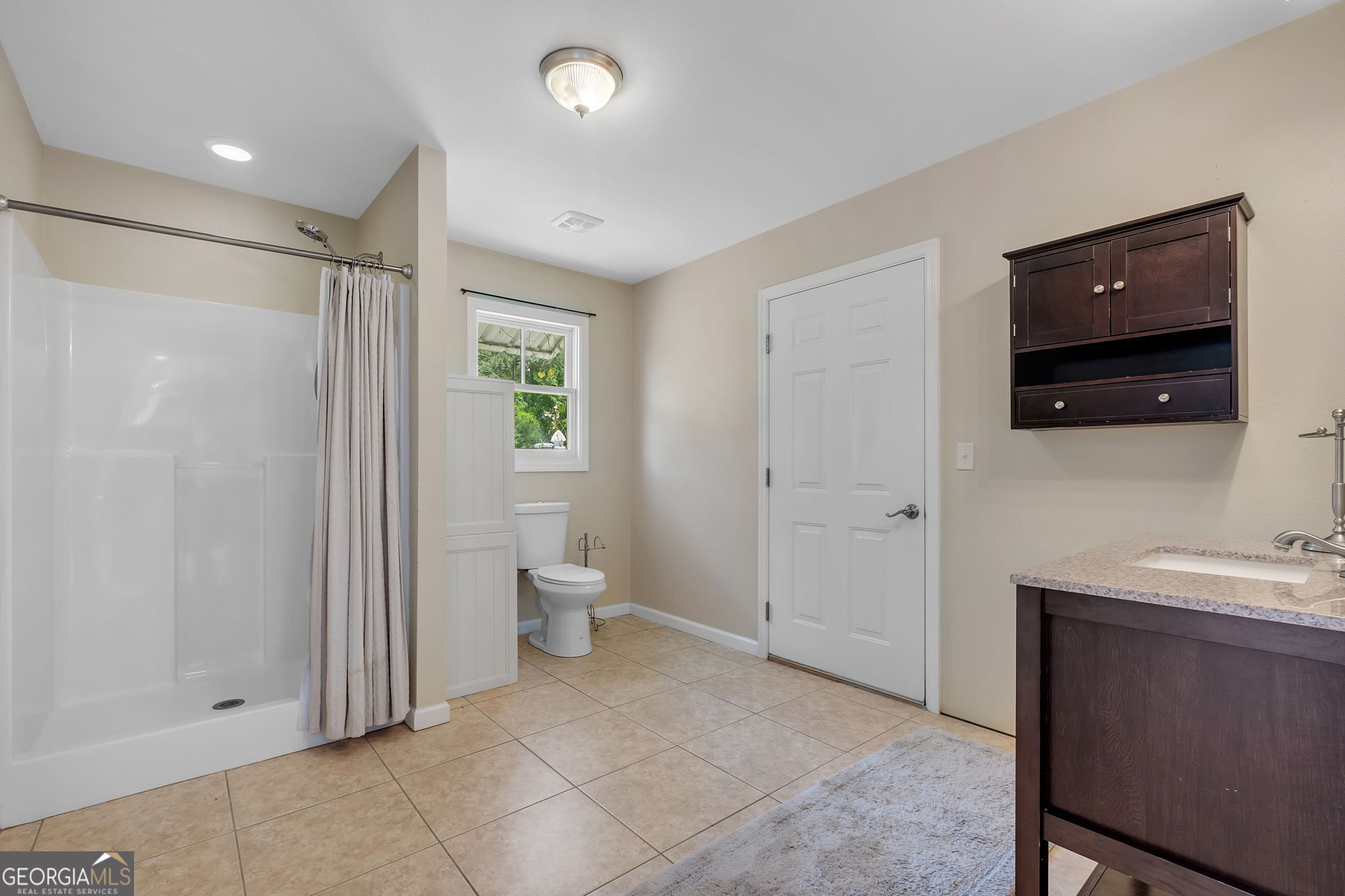171 Council Lane Cairo, GA 39828 - Photo 34 of 44 a spacious bathroom with a sink and a mirror