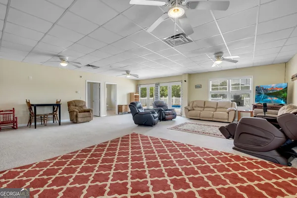a bedroom with furniture and a rug