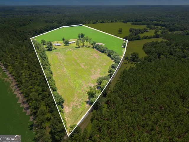 an aerial view of a house with pool